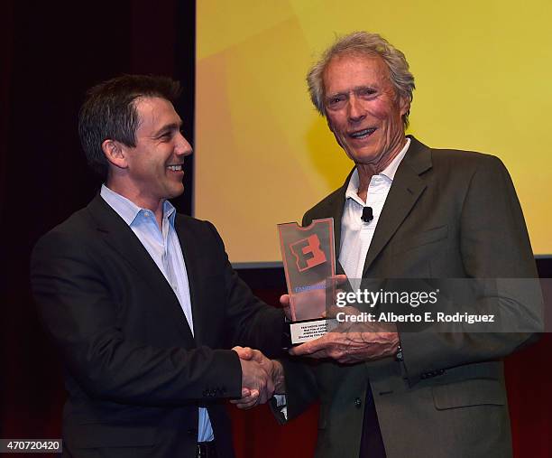 President of Fandango Paul Yanover presents Clint Eastwood with the Fan Choice award for Favorite Film of 2014, 'American Sniper,' onstage during...