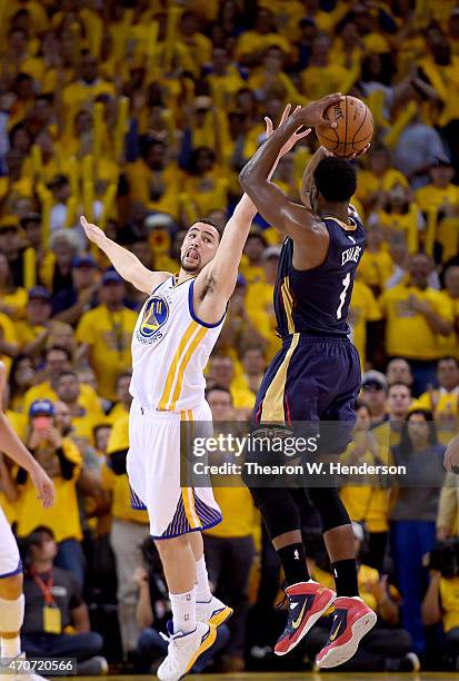 Tyreke Evans of the New Orleans Pelicans shoots over Klay Thompson of the Golden State Warriors in the second quarter during the first round of the...