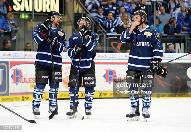 Jeffrey Szwez, Brendan Brooks and Dustin Friesen of ERC Ingolstadt react after the game between ERC Ingolstadt and Adler Mannheim on April 22, 2015...