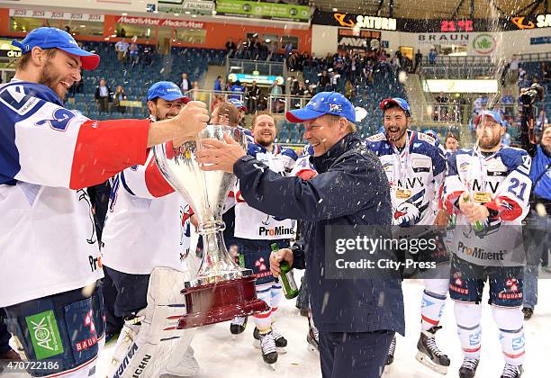 Matthias Plachta, Dennis Endras and coach Geoff Ward of Adler Mannheim celebrate after the game between ERC Ingolstadt and Adler Mannheim on April...