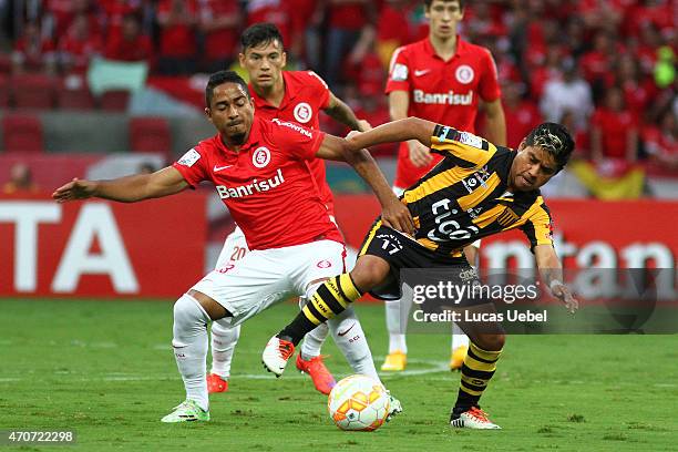 Jorge Henrique of Internacional battles for the ball against Nelvin Soliz of The Strongest during match between Internacional and The Strongest as...