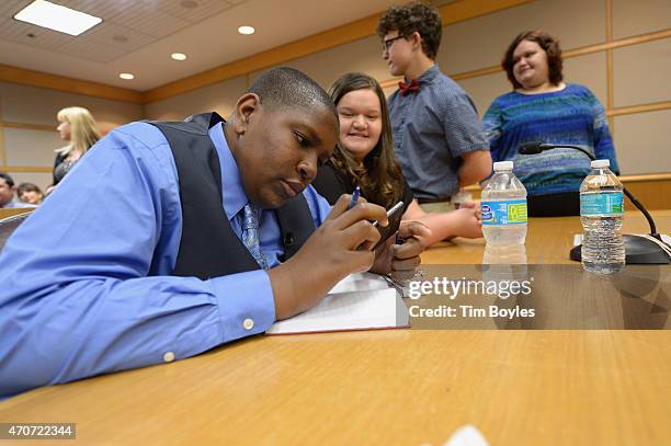 Davion Navar Henry Only writes in his new journal with his new family Carley Going, Taylor Going and Sydney Going during their formal adoption...