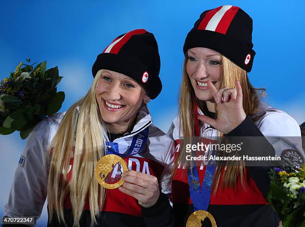 Gold medalists Kaillie Humphries and Heather Moyse of Canada team 1 celebrate during the medal ceremony for the Women's Bobsleigh on day thirteen of...