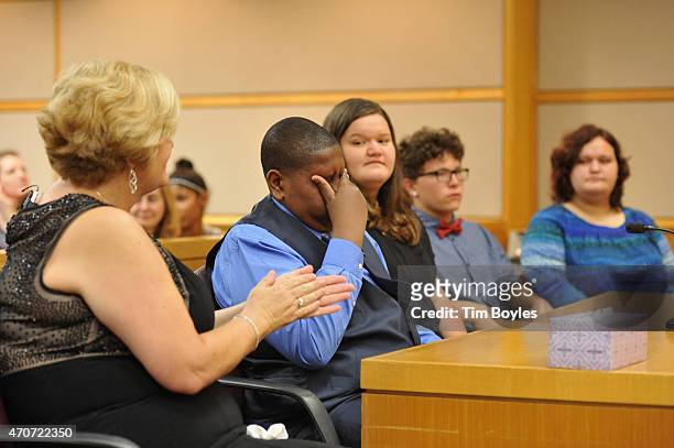 Davion Navar Henry Only reacts with his adoptive mother and former caseworker Connie Going and new siblings Carley Going, Taylor Going and Sydney...