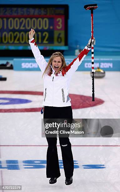 Jennifer Jones of Canada celebrates after placing a stone to win the gold medal looks on during the Gold medal match between Sweden and Canada on day...