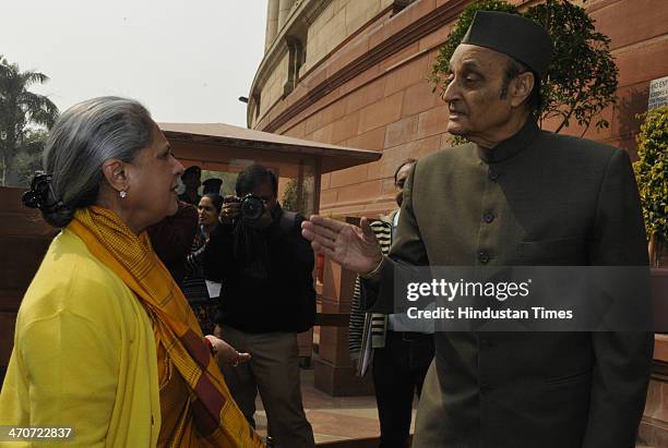 Rajya Sabha MP Jaya Bachchan talking with Congress MP Karan Singh after attending extended winter session of Parliament on February 20, 2014 in New...