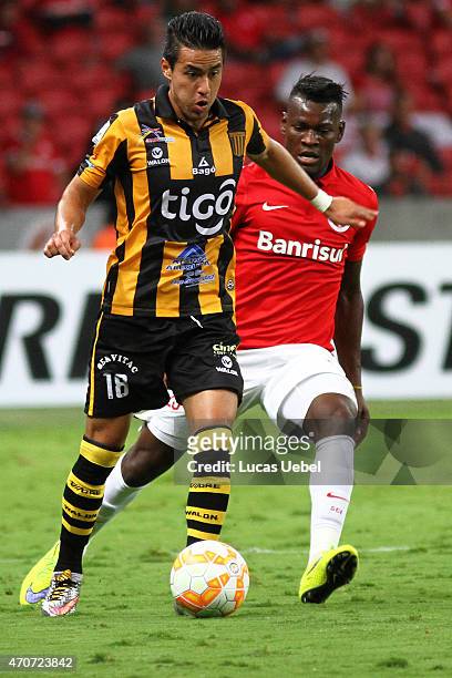 Paulao of Internacional battles for the ball against Raul Castro of The Strongest during match between Internacional and The Strongest as part of...