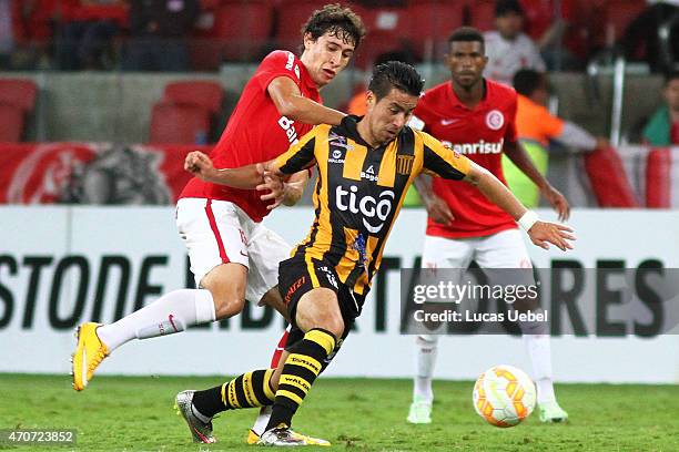 Rodrigo Dourado of Internacional battles for the ball against Ernesto Cristaldo of The Strongest during match between Internacional and The Strongest...