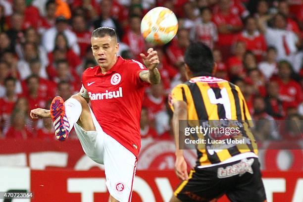 Andres Dalessandro of Internacional battles for the ball against Daniel Vaca of The Strongest during match between Internacional and The Strongest as...