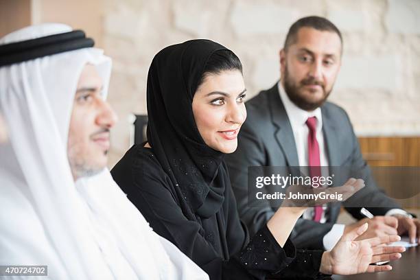 arab businesswoman in business meeting with colleagues - emirati at work stock pictures, royalty-free photos & images