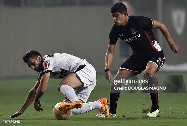 Datolo , of Brazil's Atletico Mineiro vies for the ball with Esteban Pavez of Chile's Colo Colo during their 2015 Libertadores Cup match at the...