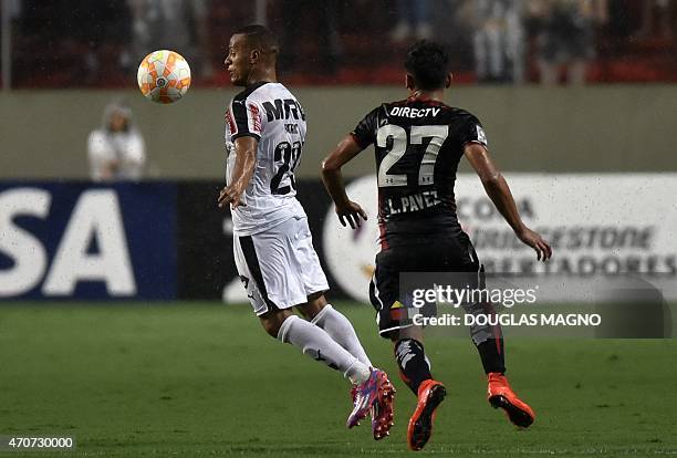Patric of Brazil's Atletico Mineiro vies for the ball with Esteban Pavez of Chile's Colo Colo during their 2015 Libertadores Cup match at the...