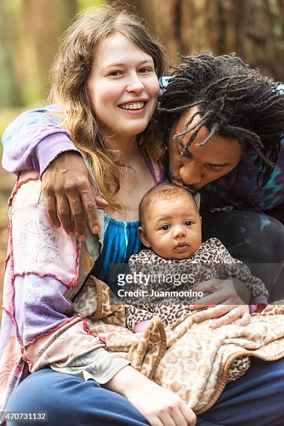 loving mixed race family - young couple with baby stock pictures, royalty-free photos & images