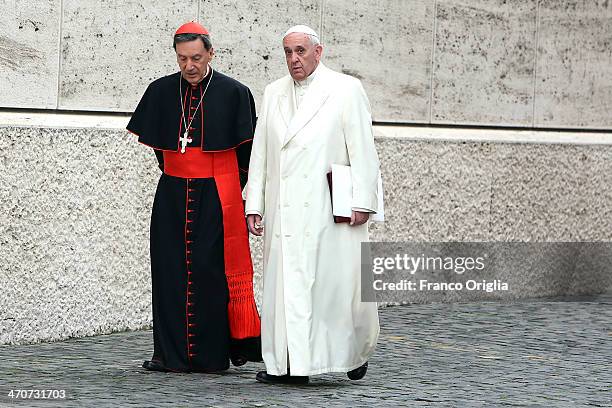 Pope Francis , flanked by Colombian Cardinal Ruben Salazar Gomez, arrives at the Paul VI Hall for an Extraordinary Consistory on the themes of Family...