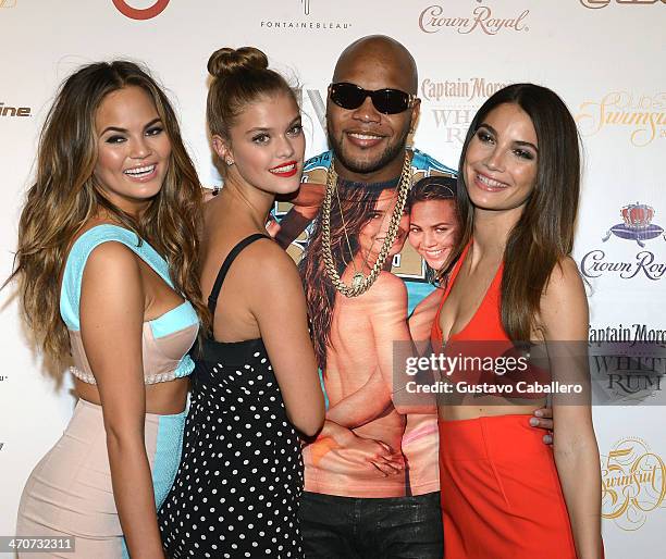 Chrissy Teigen, Nina Agdal, Flo Rida, and Lily Aldridge attend Club SI Swimsuit at LIV nightclub at Fontainebleau Miami on February 19, 2014 in Miami...