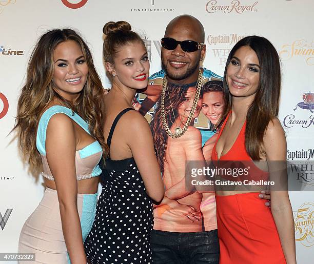 Chrissy Teigen, Nina Agdal, Flo Rida, and Lily Aldridge attend Club SI Swimsuit at LIV nightclub at Fontainebleau Miami on February 19, 2014 in Miami...