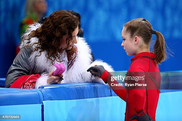 Yulia Lipnitskaya of Russia talks with her coach Eteri Tutberidze before competing in the Figure Skating Ladies' Free Skating on day 13 of the Sochi...