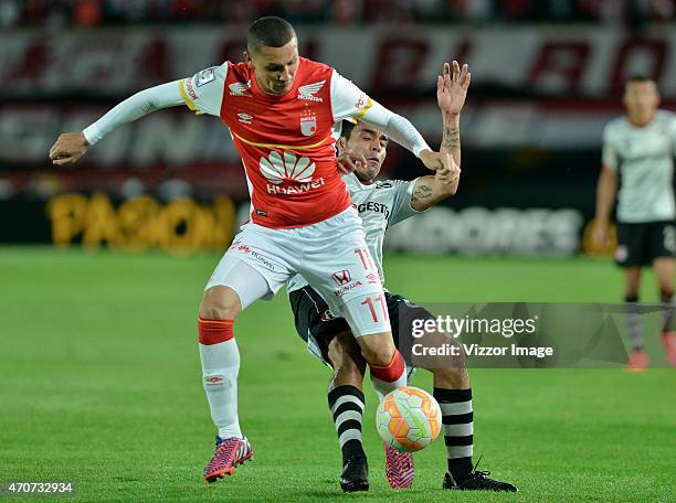 Luis Paez of Independiente Santa Fe fights for the ball with Enrique Perez of Atlas during a group 1 match between Santa Fe and Atlas as part of...