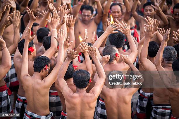 traditional kecak dance in bali in indonesia - uluwatu stock pictures, royalty-free photos & images