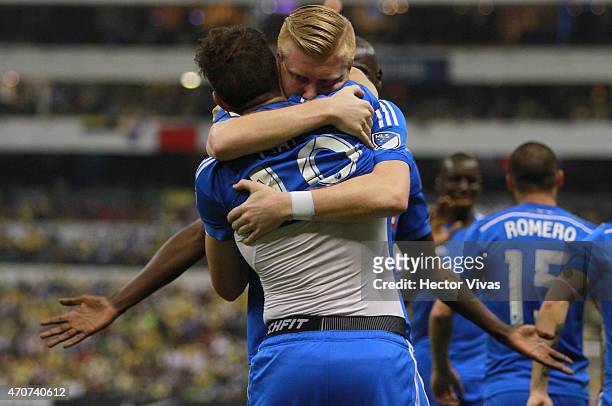 Ignacio Piatti of Montreal Impact celebrates with Calum Mallace after scoring the first goal of his team during a Championship first leg match...