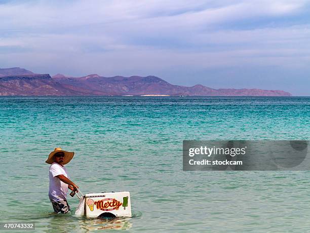 floating icecream vendor at beach - baja california peninsula stock pictures, royalty-free photos & images