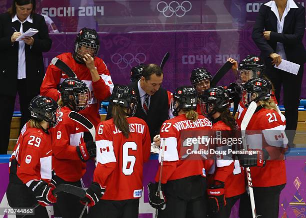 Head coach Kevin Dineen of Canada instructs his players in the third period against the United States during the Ice Hockey Women's Gold Medal Game...