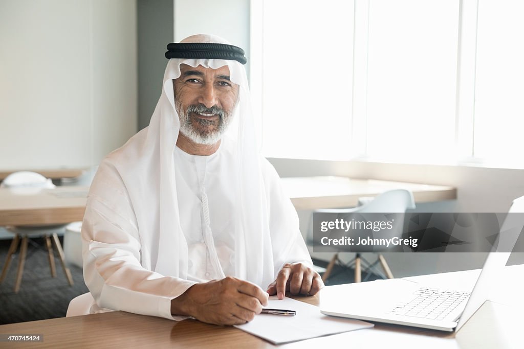 Arab businessman confident and smiling in office