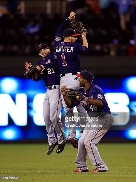 Outfielders Shane Robinson, Jordan Schafer and Torii Hunter of the Minnesota Twins celebrate after the twins defeated the Kansas City Royals 3-0 to...