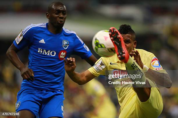 Michael Arroyo of America struggles for the ball with Bakary Soumare of Montreal Impact during a Championship first leg match between America and...