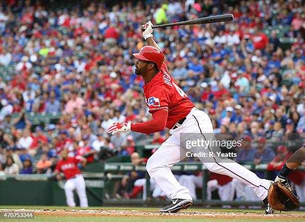 Jason Castro of the Houston Astros looks on as Carlos Peguero of the Texas Rangers hits in the first inning at Globe Life Park in Arlington on April...