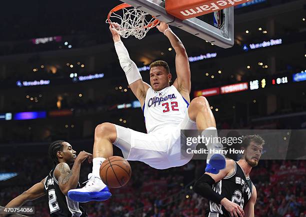 Blake Griffin of the Los Angeles Clippers dunks between Kawhi Leonard and Tiago Splitter of the San Antonio Spurs during the first half of Game Two...