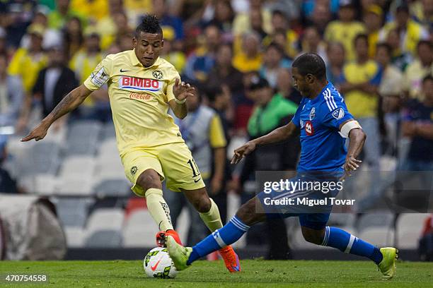 Michael Arroyo of America fights for the ball with Patrice Bernier of Montreal Impact during a Championship first leg match between America and...