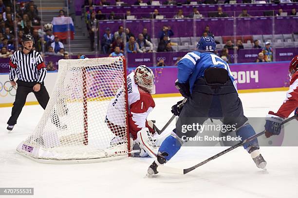 Winter Olympics: Finland Juhamatti Aaltonen in action, scoring game tying goal vs Russia goalie Semyon Varlamov during 1st period of Men's Playoffs...