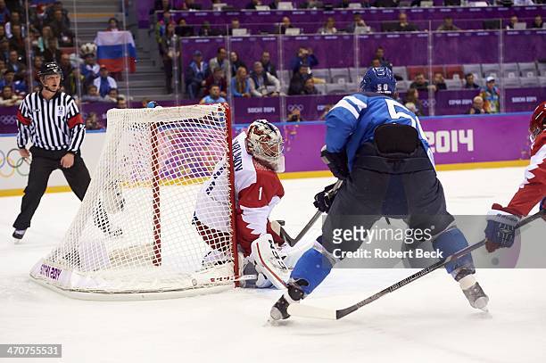 Winter Olympics: Finland Juhamatti Aaltonen in action, scoring game tying goal vs Russia goalie Semyon Varlamov during 1st period of Men's Playoffs...
