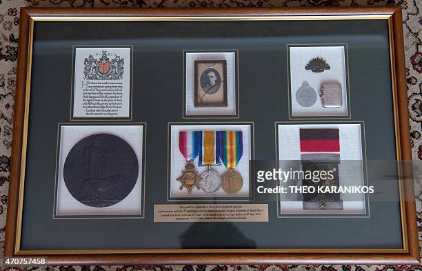 Australia-history-WWI-Gallipoli-graves,FEATURE by Madeleine Coorey This photo taken on April 17, 2015 shows framed medals, tags and badges from...