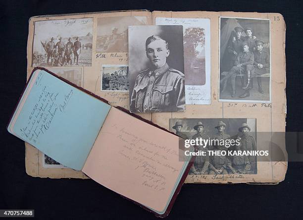 Australia-history-WWI-Gallipoli-graves,FEATURE by Madeleine Coorey This photo taken on April 17, 2015 shows a scrap book of old photos and an...