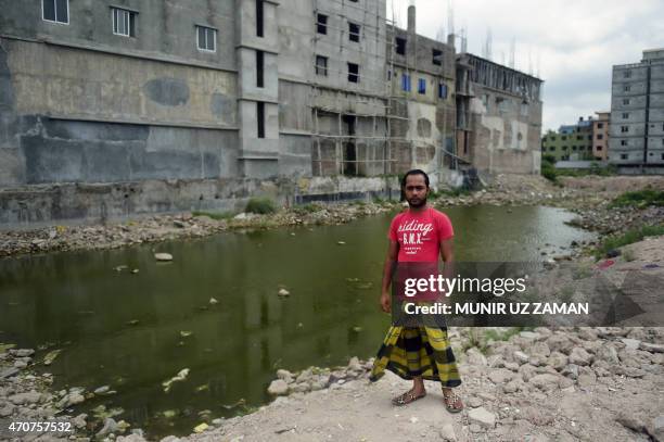 Bangladesh-disaster-textile-missing,FOCUS by Shafiqul Alam In this photograph taken on April 21 a Bangladeshi worker who was rescued from the...