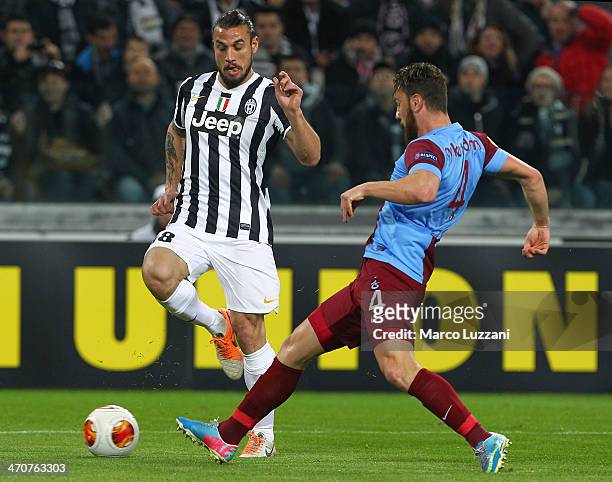 Pablo Osvaldo of Juventus FC competes for the ball with Aykut Demir of AS Trabzonspor during the UEFA Europa League Round of 32 match between...
