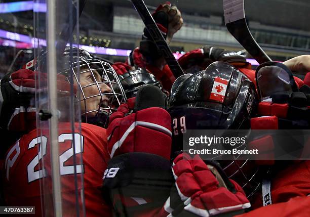 Marie-Philip Poulin and Hayley Wickenheiser of Canada celebrate after defeating the United States 3-2 in overtime during the Ice Hockey Women's Gold...