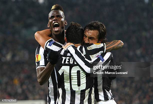 Paul Pogba of Juventus FC celebrates with his team-mates Carlos Tevez and Andrea Pirlo during the UEFA Europa League Round of 32 match between...