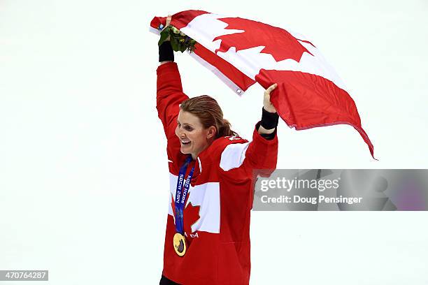 Gold medalist Hayley Wickenheiser of Canada celebrates during the flower ceremony for the Ice Hockey Women's Gold Medal Game on day 13 of the Sochi...