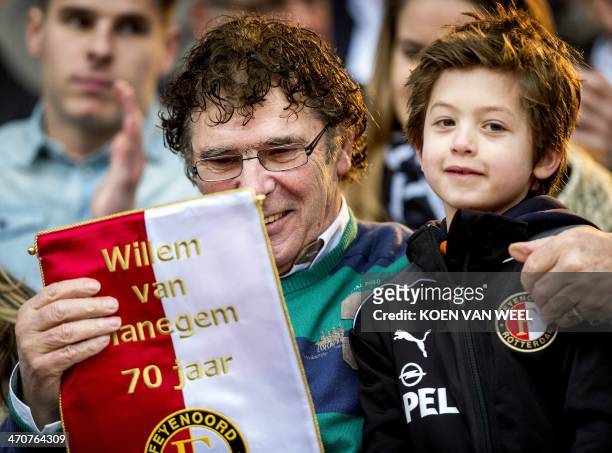 Dutch former soccer player and Feyenoord icon Willem van Hanegem receives a present from a young player during the celebration of his 70th birthday...