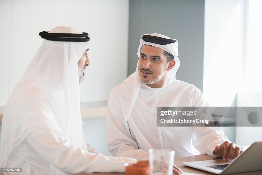 Arab businessmen in discussion