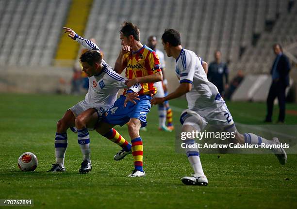 Ognjen Vukojevic of FC Dynamo Kyiv vies with Michel of Valencia CFduring the Europa League Round of 16 match between FC Dynamo Kyiv and Valencia CF...