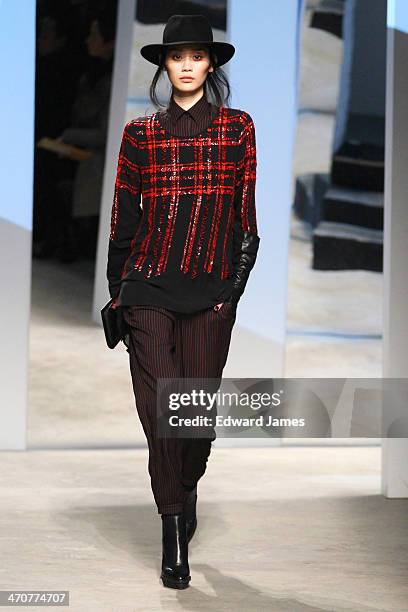 Model walks the runway at the Kenneth Cole Collection fashion show during Mercedes-Benz Fashion Week Fall 2014 at The Garage at Lincoln Center on...