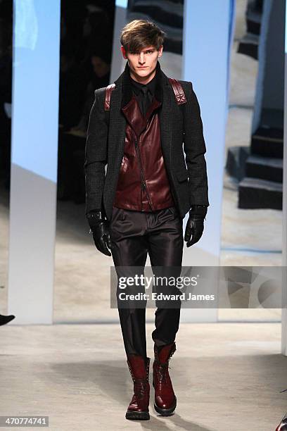 Model walks the runway at the Kenneth Cole Collection fashion show during Mercedes-Benz Fashion Week Fall 2014 at The Garage at Lincoln Center on...