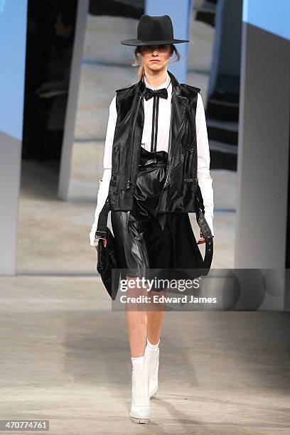 Model walks the runway at the Kenneth Cole Collection fashion show during Mercedes-Benz Fashion Week Fall 2014 at The Garage at Lincoln Center on...