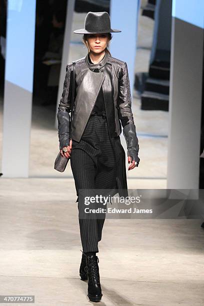 Model walks the runway at the Kenneth Cole Collection fashion show during Mercedes-Benz Fashion Week Fall 2014 at The Garage at Lincoln Center on...