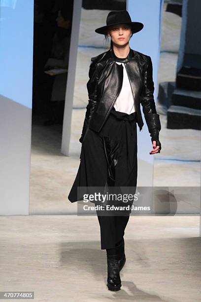 Model walks the runway at the Kenneth Cole Collection fashion show during Mercedes-Benz Fashion Week Fall 2014 at The Garage at Lincoln Center on...