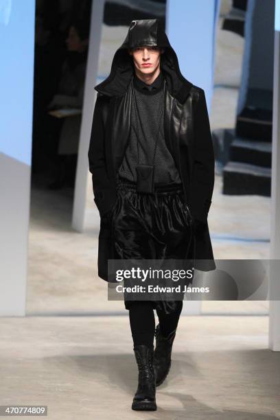 Model walks the runway at the Kenneth Cole Collection fashion show during Mercedes-Benz Fashion Week Fall 2014 at The Garage at Lincoln Center on...